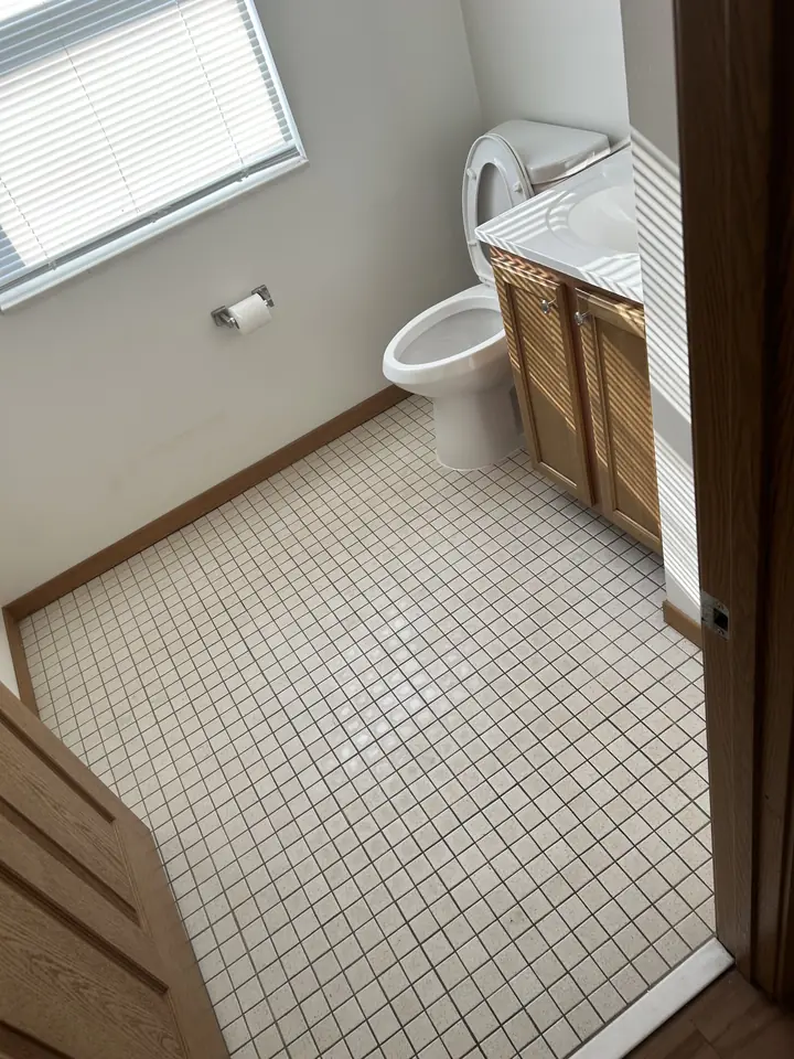 Bathroom after a Fresh Start cleaning in St. Louis, MO — floor tile, fixtures and surfaces