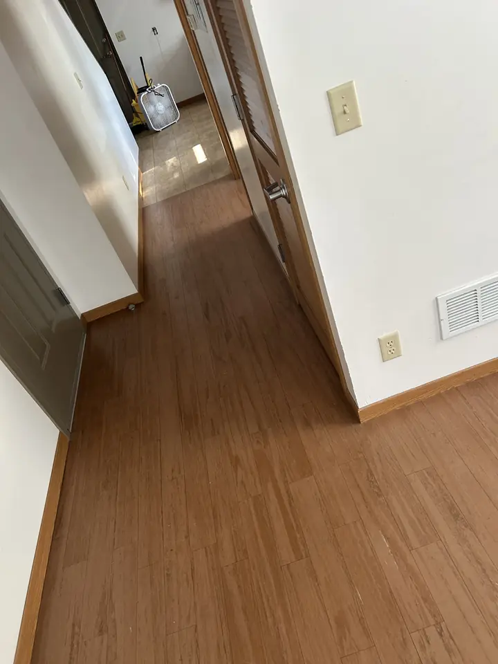 Hallway after a Fresh Start cleaning in St. Louis, MO — hard floors, walls and trim