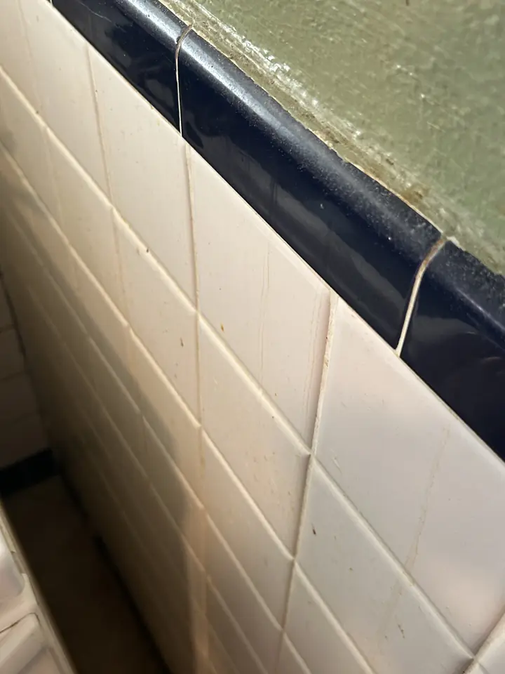 Kitchen before a Fresh Start cleaning in St. Louis, MO — tile, grout line and trim