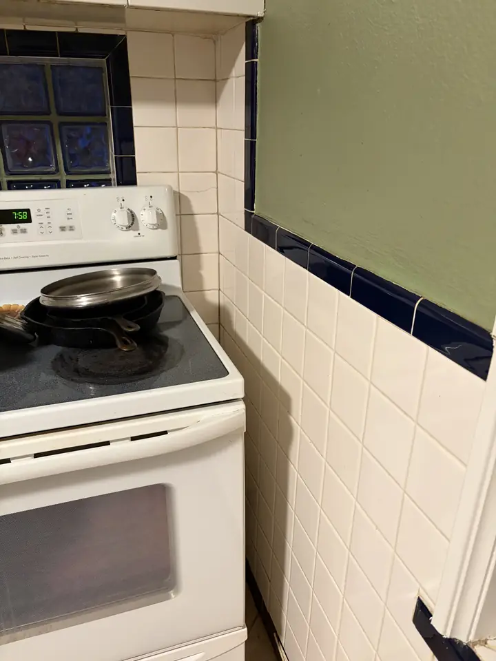 Kitchen after a Fresh Start cleaning in St. Louis, MO — stove-side tile