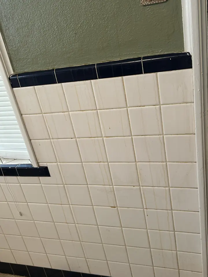 Kitchen before a Fresh Start cleaning in St. Louis, MO — tile wall and window ledge